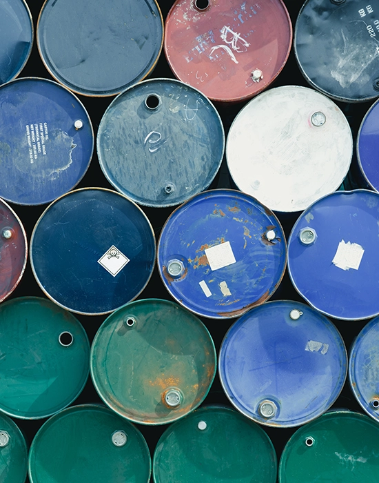 stack of hazardous waste barrels in different colors. Hazardous waste, Solid Waste, TCLP test, Hazardous Waste characterization, Waste Characterization, RCRA waste characterization