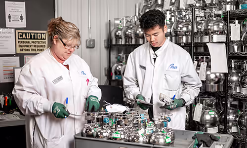 Pace Scientists working on air sampling canisters in Air Laboratory.